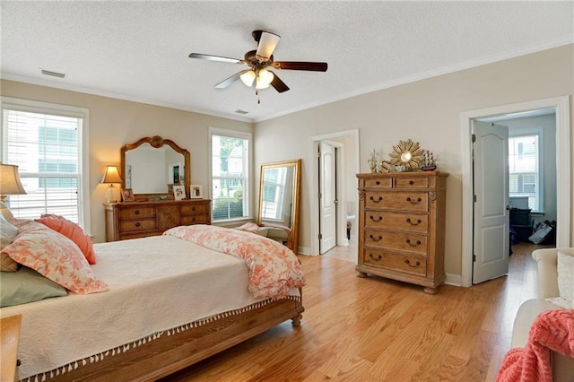 125 Rabbits Run, Fayetteville, GA 30215 - bedroom featuring light wood-style floors, crown molding, a textured ceiling, a ceiling fan, and baseboards