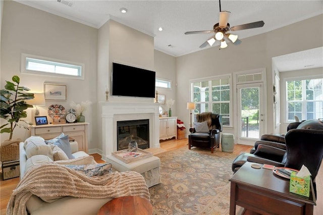 125 Rabbits Run, Fayetteville, GA 30215 - living room featuring ceiling fan, light wood-style flooring, a fireplace, crown molding, and recessed lighting