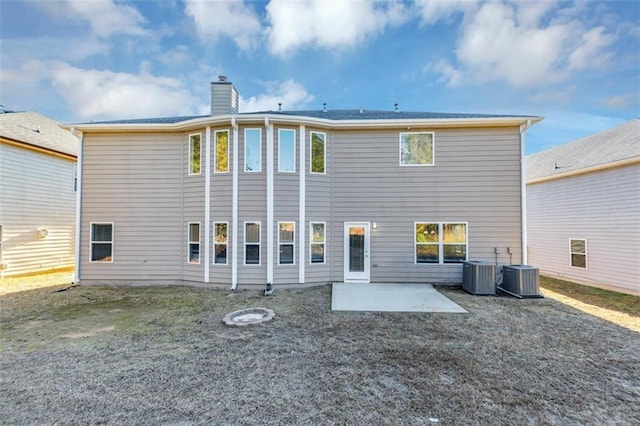 back of property with a patio and central AC unit