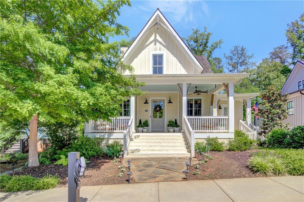 11190 Serenbe Ln, Chattahoochee Hills, GA 30268 - view of front of property featuring a ceiling fan, covered porch, and board and batten siding