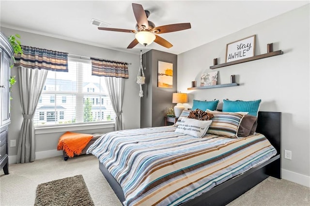 bedroom with carpet floors, baseboards, and a ceiling fan