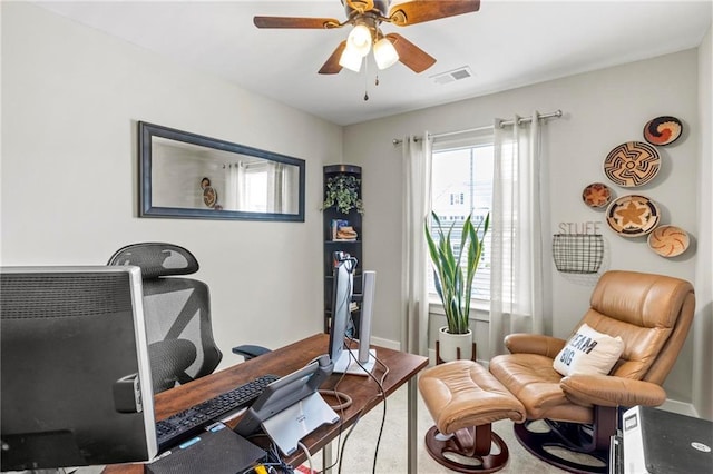exercise area featuring a ceiling fan and baseboards
