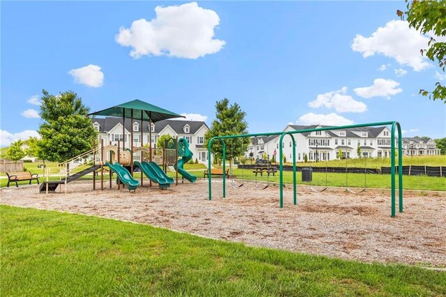 community play area with a residential view and a yard