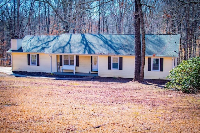 single story home with covered porch