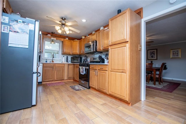 kitchen with tasteful backsplash, light wood-type flooring, pendant lighting, ceiling fan, and stainless steel appliances