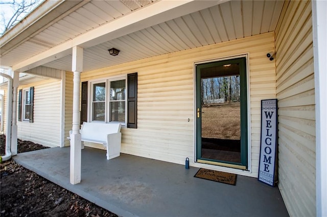 entrance to property featuring covered porch