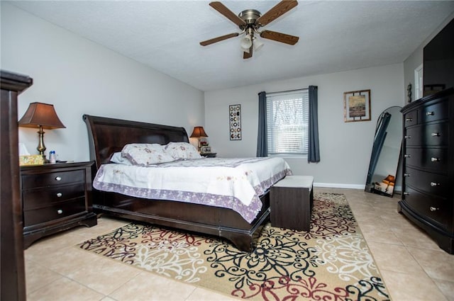 bedroom featuring light tile patterned flooring and ceiling fan