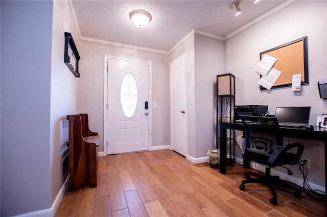 office with crown molding, a textured ceiling, and light hardwood / wood-style flooring