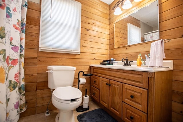 bathroom featuring a shower with curtain, vanity, toilet, and wood walls