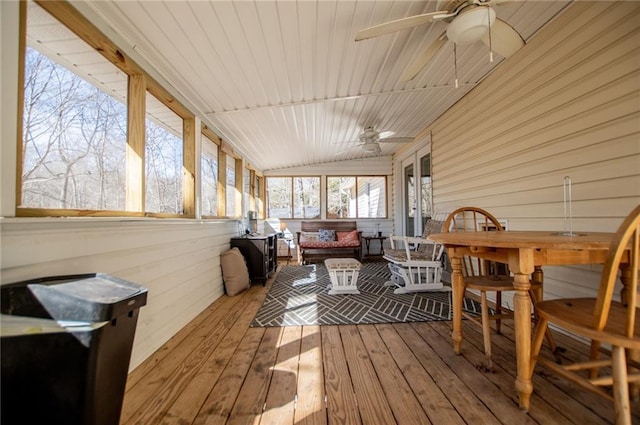 sunroom / solarium featuring wood ceiling, ceiling fan, and lofted ceiling