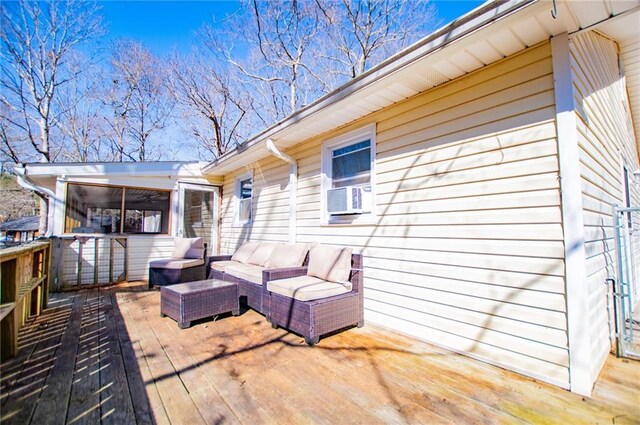 wooden deck with outdoor lounge area and cooling unit