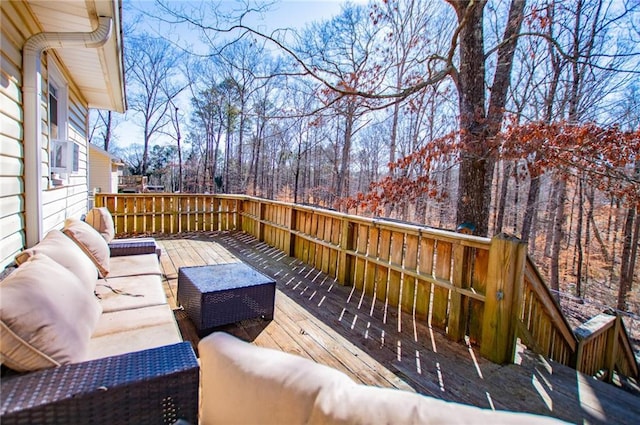 wooden terrace featuring an outdoor living space