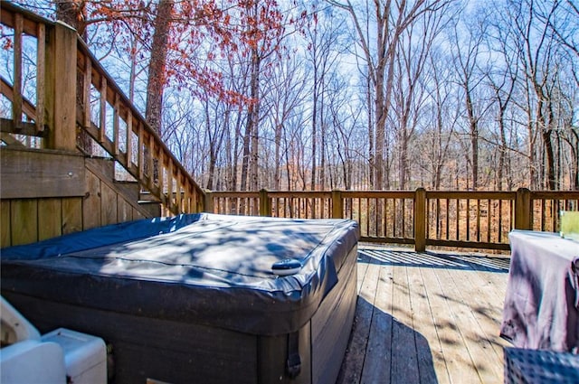 wooden terrace with a hot tub