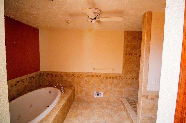 20 Lisa Ct, Stockbridge, GA 30281 - bathroom featuring a whirlpool tub, a ceiling fan, a tile shower, tile walls, and a textured ceiling