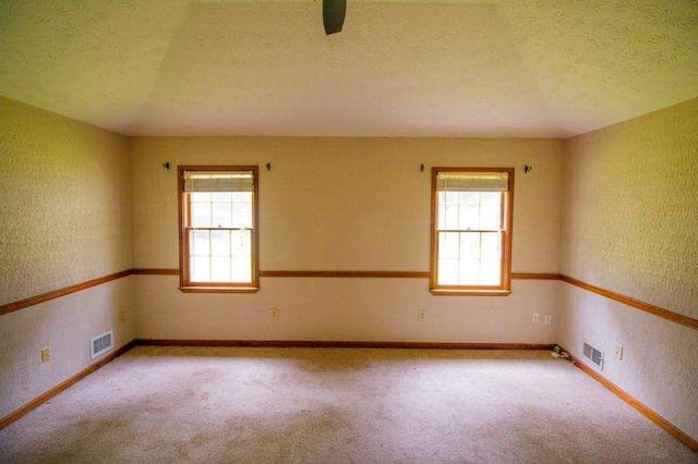 20 Lisa Ct, Stockbridge, GA 30281 - empty room with baseboards, light colored carpet, and a textured ceiling