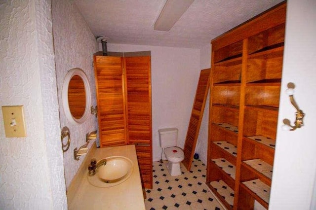 20 Lisa Ct, Stockbridge, GA 30281 - bathroom featuring toilet, vanity, and tile patterned floors