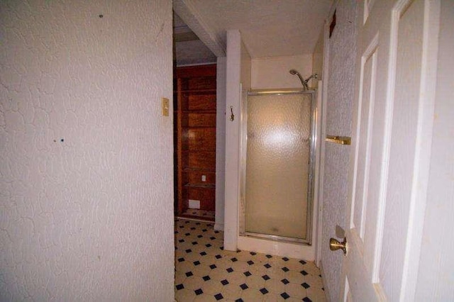 20 Lisa Ct, Stockbridge, GA 30281 - bathroom featuring a shower stall, tile patterned floors, and a textured wall