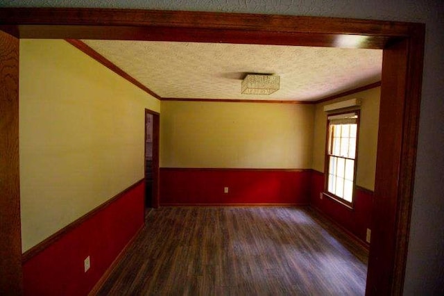 20 Lisa Ct, Stockbridge, GA 30281 - unfurnished room with dark wood-style floors, crown molding, a textured ceiling, and vaulted ceiling