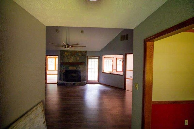 20 Lisa Ct, Stockbridge, GA 30281 - unfurnished living room featuring wood finished floors, vaulted ceiling, ceiling fan, and a fireplace