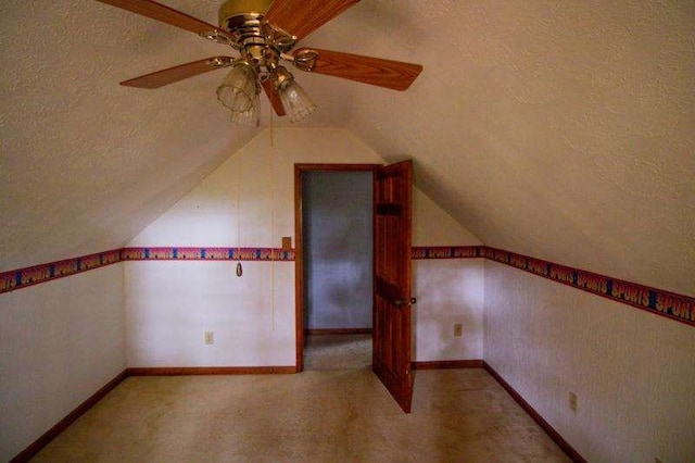 20 Lisa Ct, Stockbridge, GA 30281 - additional living space featuring a textured ceiling, a ceiling fan, lofted ceiling, light colored carpet, and baseboards