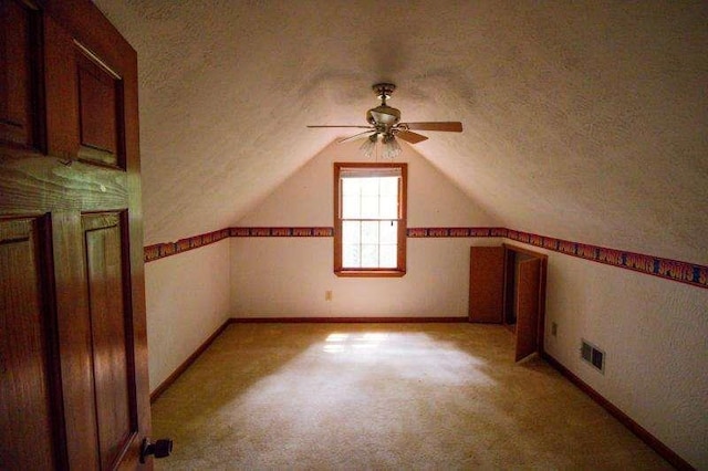 20 Lisa Ct, Stockbridge, GA 30281 - bonus room featuring a textured ceiling, ceiling fan, baseboards, light carpet, and vaulted ceiling
