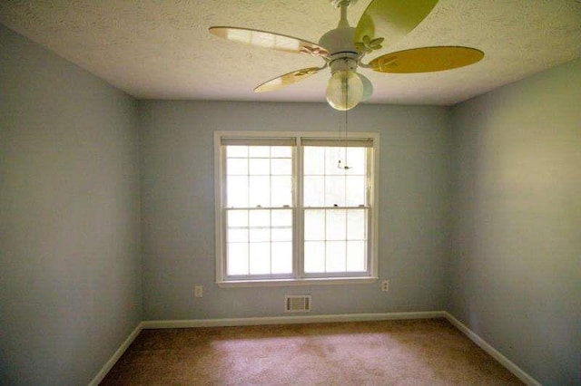 20 Lisa Ct, Stockbridge, GA 30281 - empty room with baseboards, carpet, a textured ceiling, and ceiling fan