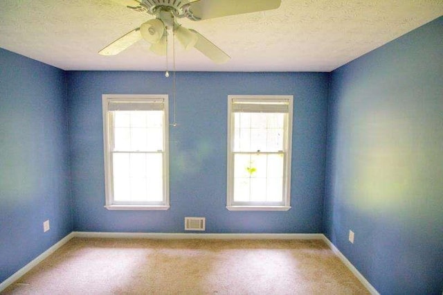 20 Lisa Ct, Stockbridge, GA 30281 - carpeted spare room with baseboards, ceiling fan, and a textured ceiling