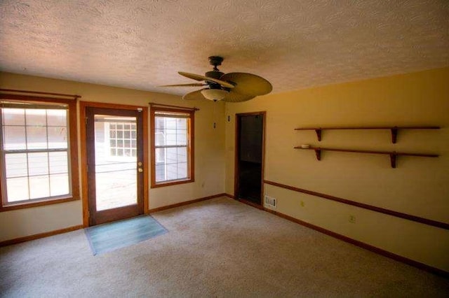20 Lisa Ct, Stockbridge, GA 30281 - unfurnished room with a textured ceiling, light colored carpet, ceiling fan, and baseboards