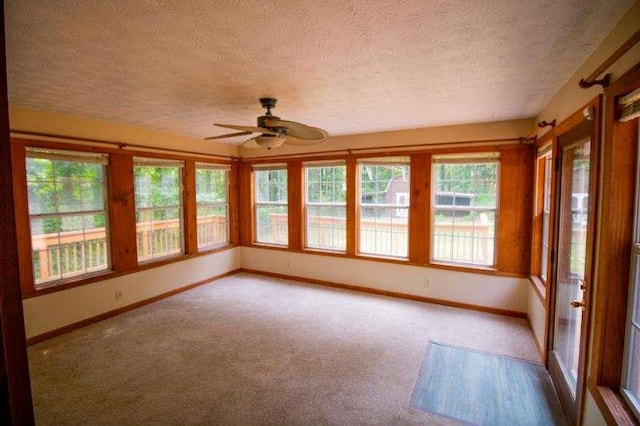 20 Lisa Ct, Stockbridge, GA 30281 - unfurnished sunroom with a textured ceiling, baseboards, and carpet flooring
