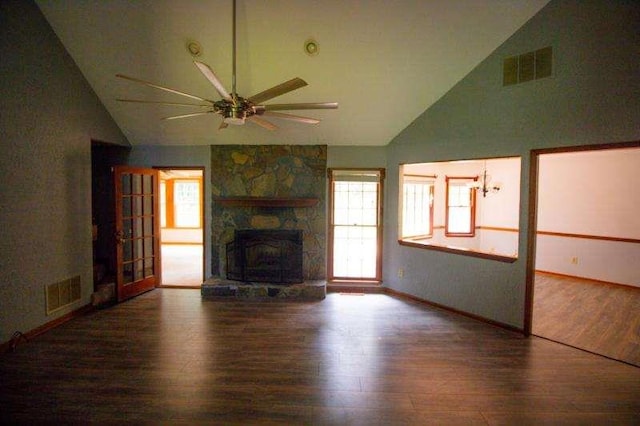 20 Lisa Ct, Stockbridge, GA 30281 - unfurnished living room featuring ceiling fan, wood finished floors, high vaulted ceiling, a stone fireplace, and baseboards
