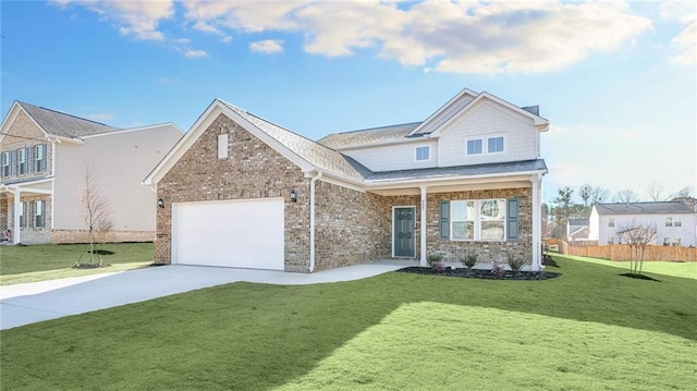 view of front of property with a garage and a front yard