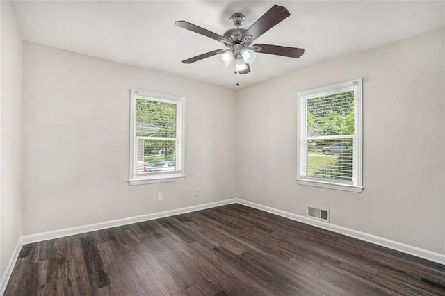 3204 Robin Rd, Decatur, GA 30032 - spare room with plenty of natural light, baseboards, dark wood finished floors, and ceiling fan
