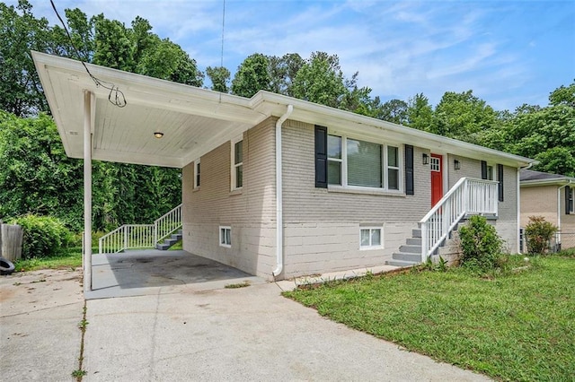 3204 Robin Rd, Decatur, GA 30032 - view of front of home featuring concrete driveway, a carport, a front lawn, and brick siding