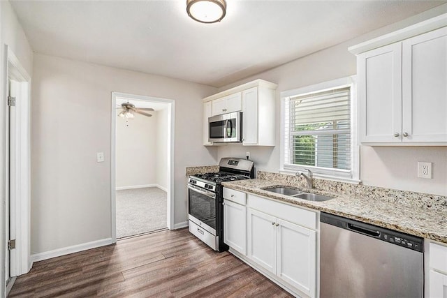 3204 Robin Rd, Decatur, GA 30032 - kitchen featuring stainless steel appliances, a sink, dark wood-type flooring, and light stone counters