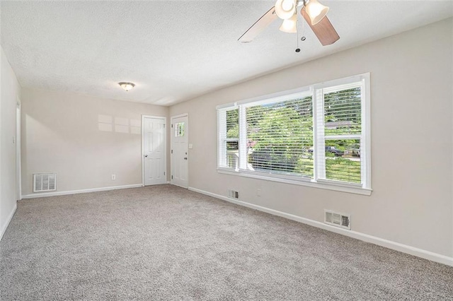 3204 Robin Rd, Decatur, GA 30032 - spare room with baseboards, a ceiling fan, carpet, and a textured ceiling