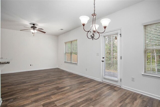 interior space featuring a wealth of natural light and dark hardwood / wood-style flooring