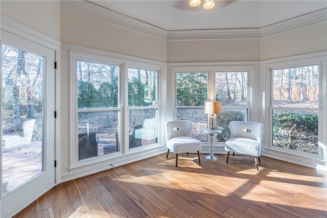 sunroom featuring vaulted ceiling