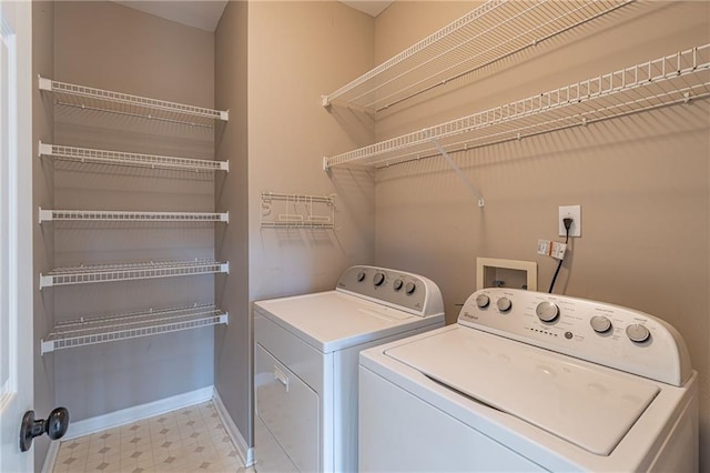 washroom with washer and dryer