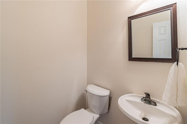 bathroom featuring sink and toilet