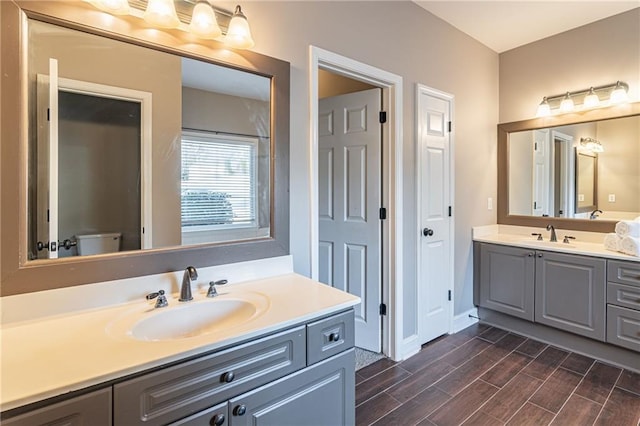 bathroom featuring toilet and vanity