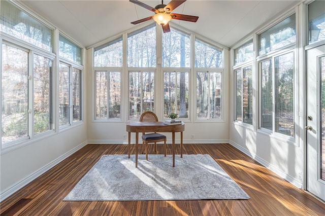 sunroom / solarium featuring a healthy amount of sunlight, ceiling fan, and vaulted ceiling