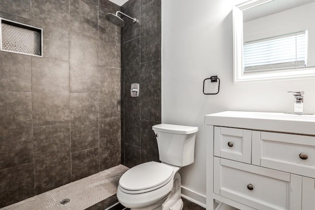 2195 Penelope St NW, Atlanta, GA 30314 - bathroom featuring vanity, baseboards, a tile shower, and toilet
