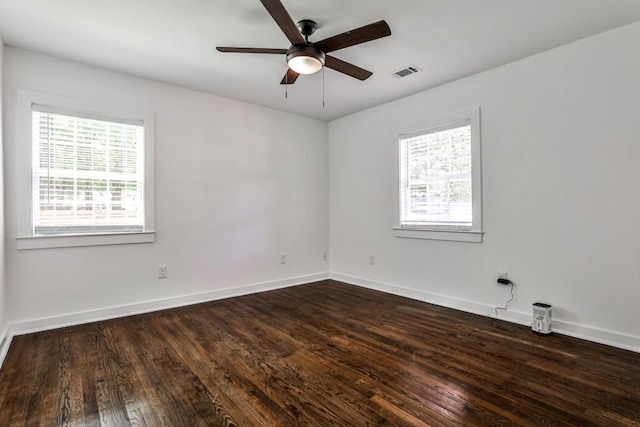 2195 Penelope St NW, Atlanta, GA 30314 - spare room featuring visible vents, dark wood-type flooring, ceiling fan, and a wealth of natural light