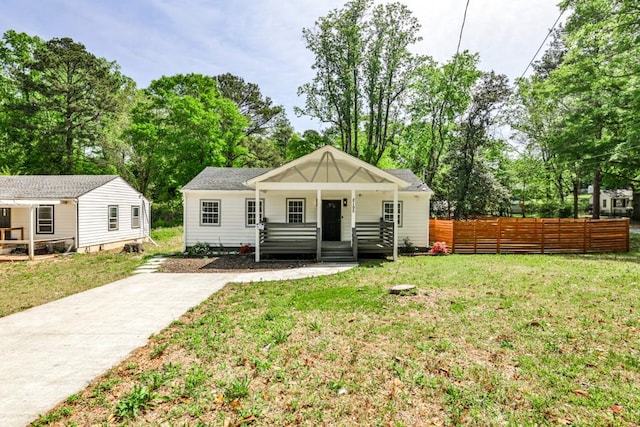 2195 Penelope St NW, Atlanta, GA 30314 - bungalow with fence, covered porch, and a front lawn