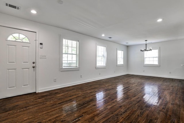 2195 Penelope St NW, Atlanta, GA 30314 - entryway with baseboards, visible vents, dark wood-type flooring, and a notable chandelier