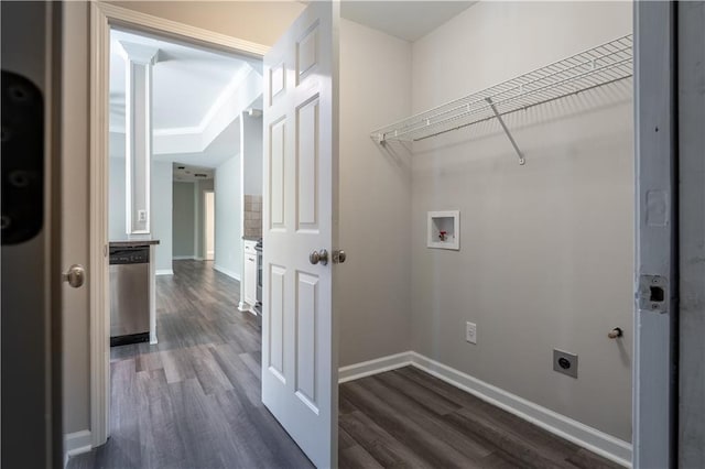 laundry room featuring dark wood finished floors, electric dryer hookup, laundry area, and baseboards