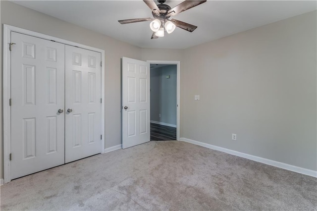 unfurnished bedroom featuring ceiling fan, baseboards, carpet flooring, and a closet