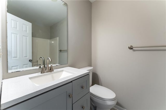 bathroom with toilet and vanity