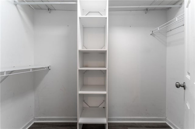spacious closet with wood finished floors
