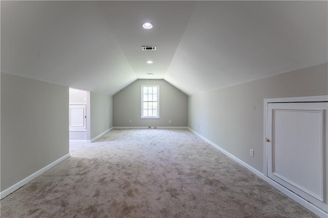 bonus room with recessed lighting, lofted ceiling, visible vents, baseboards, and carpet flooring